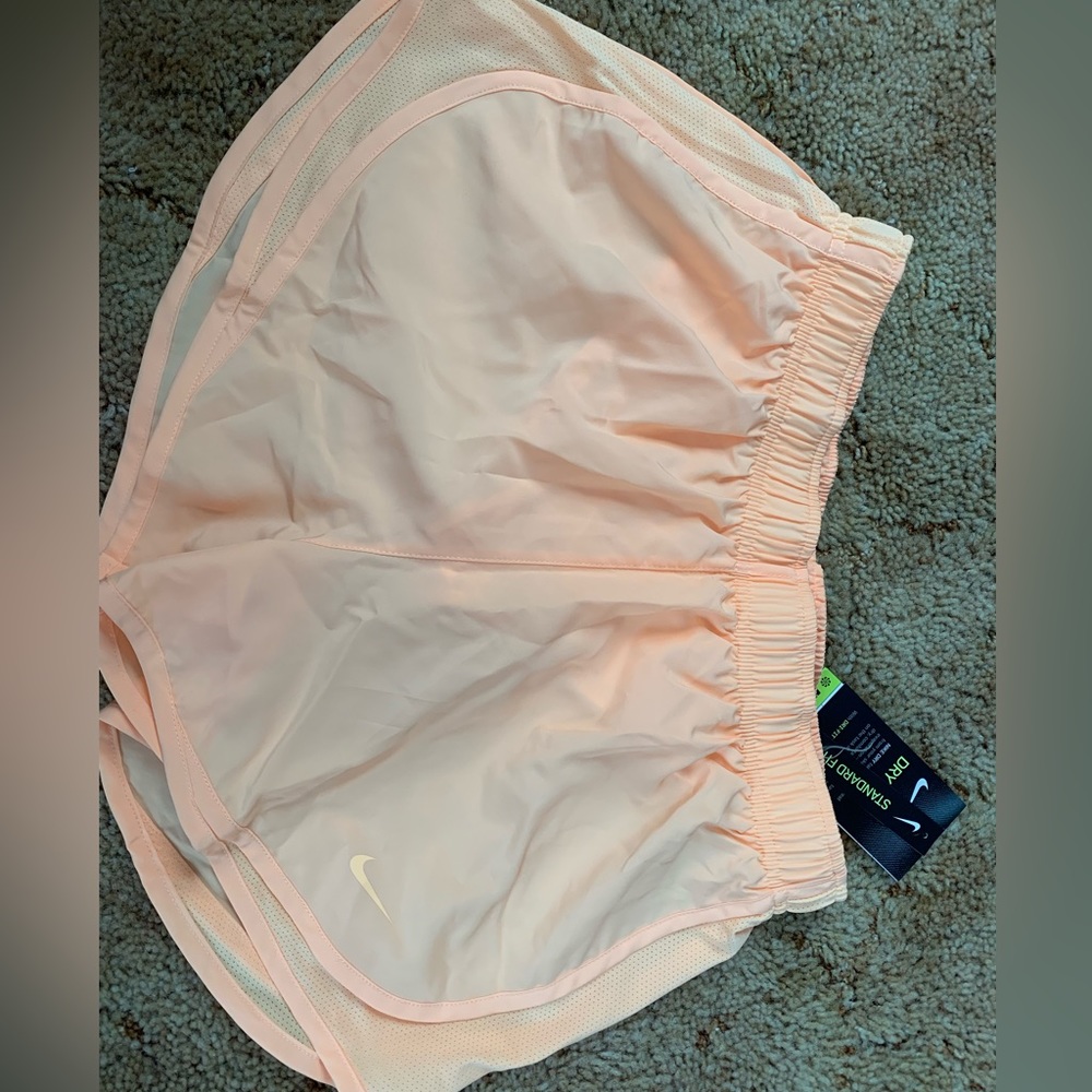 Orange Nike Dri-fit shorts.